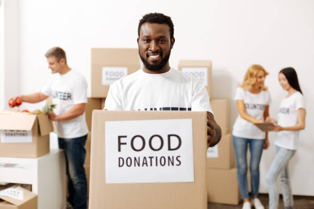 istock Generous lively man happy helping others 818593460