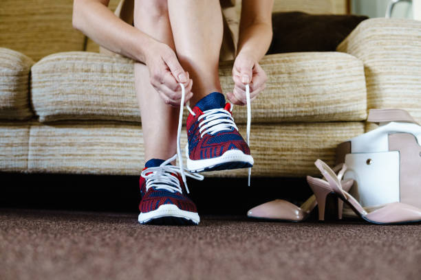 istock Getting ready for training. The concept of female feet after work. 818598638