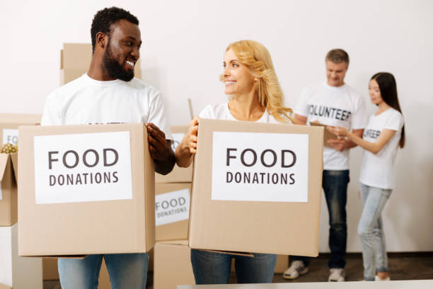 istock Admirable young people happy volunteering 818601778