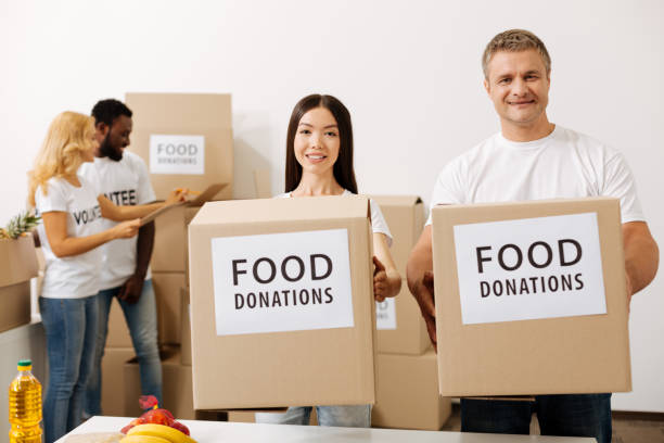istock Lively sincere people working on new charity campaign 818606438