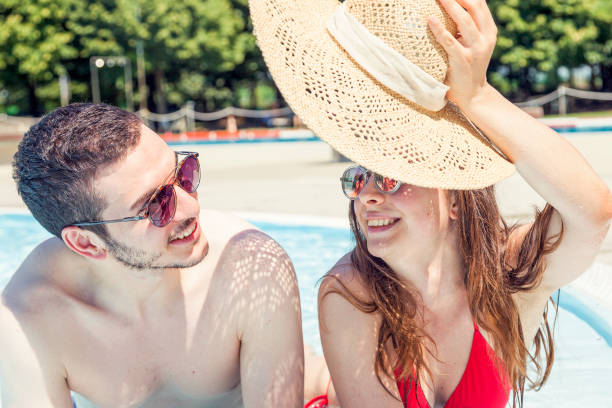 istock Young loving couple relaxes in the hydromassage 818607362