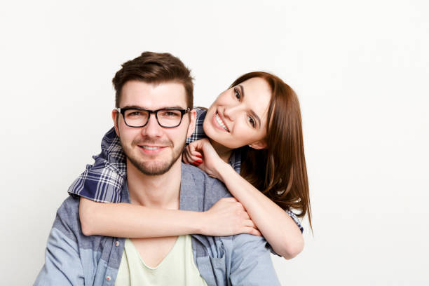istock Happy casual couple posing to camera, isolated 818612926