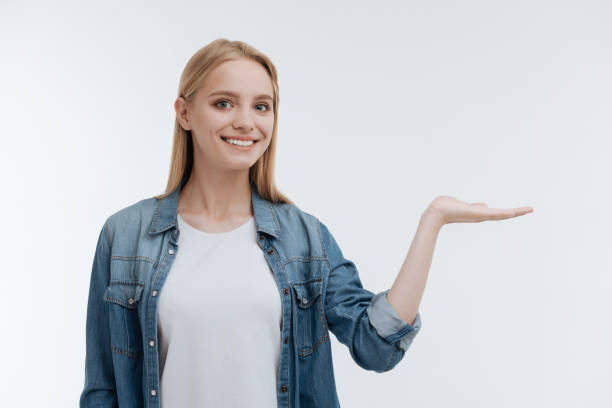 istock Cheerful blonde keeping her arm in the air 818615126