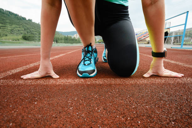 istock Female athlete ready to start. Running at the stadium. 818616182