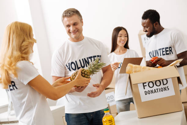 istock Bright admirable people happy helping the community 818633664
