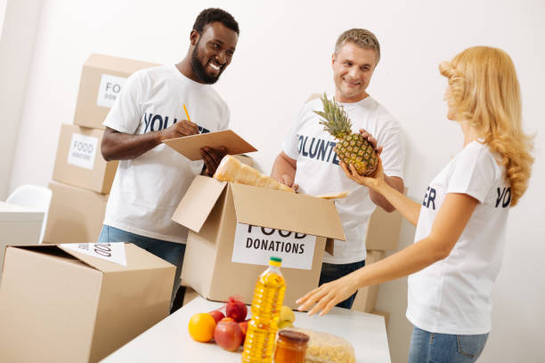 istock Bright neat volunteers sticking to the list 818638270