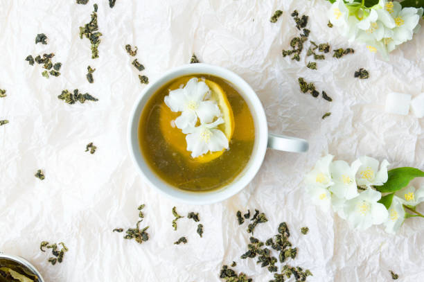 istock Green herbal tea with jasmine flowers 818645794