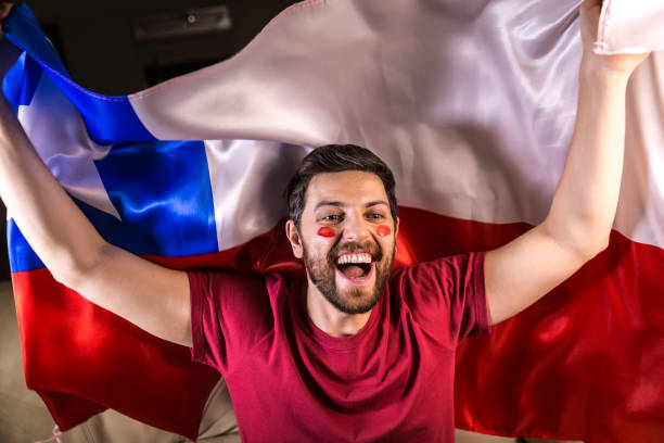 istock Chilean fan holding the national flag 818646748