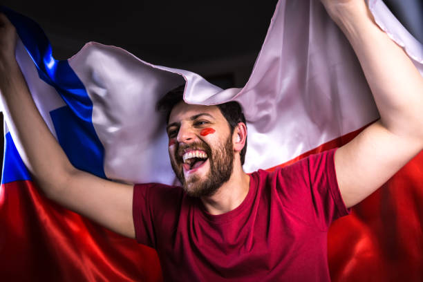 istock Chilean fan holding the national flag 818686278