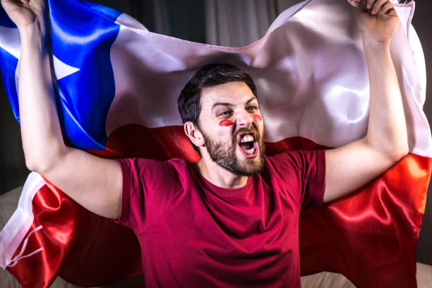 istock Chilean fan holding the national flag 818687130