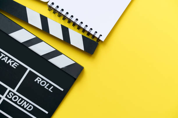istock movie clapper on yellow background 818688846