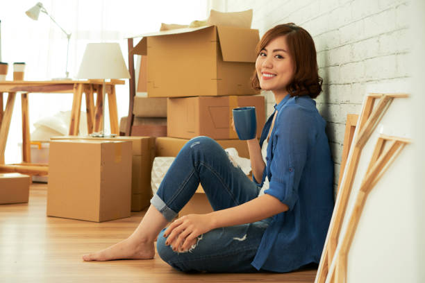 istock Attractive Woman Enjoying New Apartment 818705472