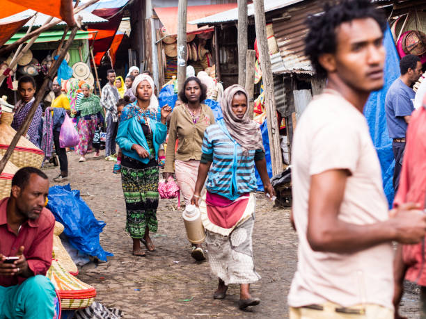People at Addis Mercato in Addis Abeba, Ethiopia Addis Abeba, Ethiopia - June 06, 2016: People at Addis Mercato in Addis Abeba, Ethiopia, the largest market in Africa. addis ababa ethiopia photos stock pictures, royalty-free photos & images