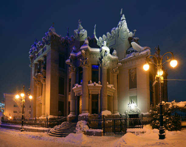 istock House with Chimaeras in evening - Kiev 818730004