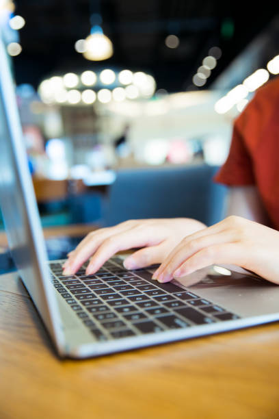 istock close-up woman working with laptop 818744966