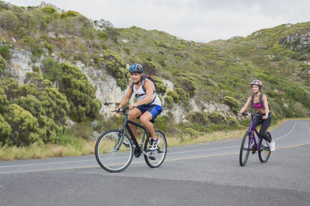 istock Athletic couple mountain biking 818746206