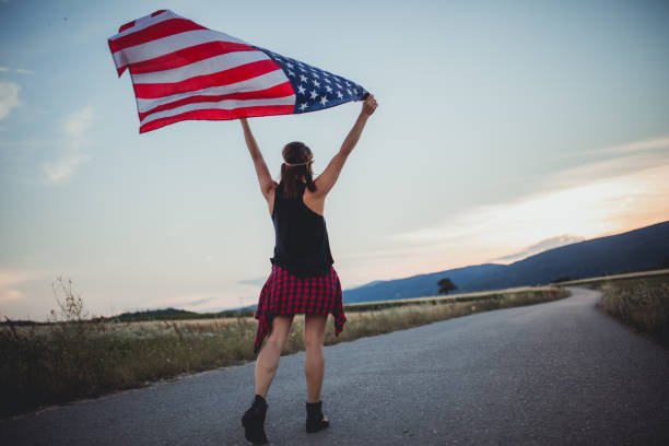 istock Girl holding US flag 818756788