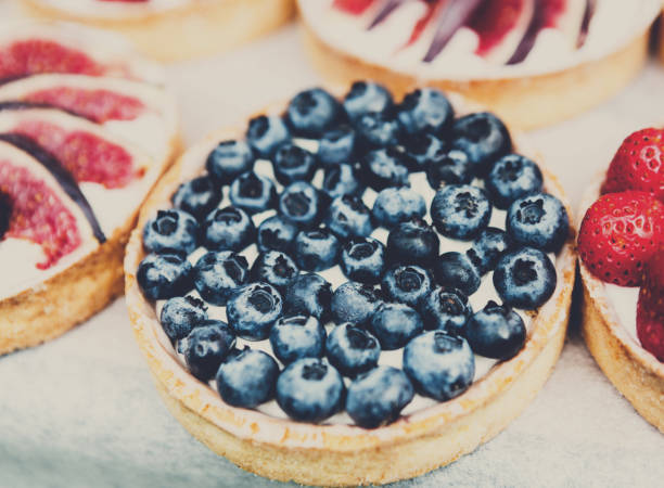 Closeuo of blueberry tart dessert tray assorted