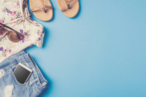 istock Woman summer clothes on blue background. 818775144