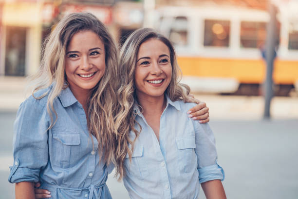 Beautiful sisters walking in the city