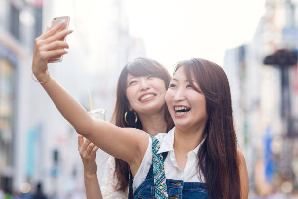 istock Two Young Women Enjoying Taking Selfie 818817410