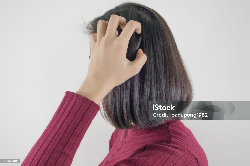 Woman scratching her head Head Stock Photo