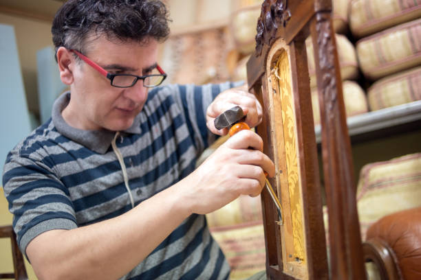 istock Small business upholsterer laboratory: Disassembling antique chair 818826658