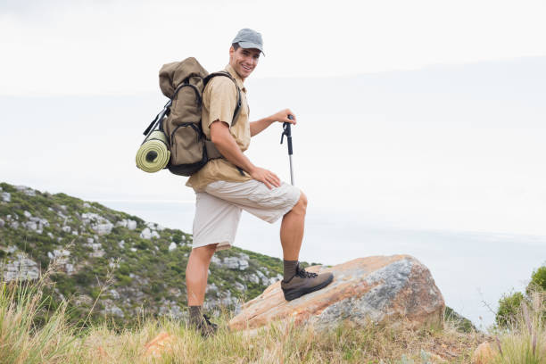 istock Hiking man walking on mountain terrain 818827150