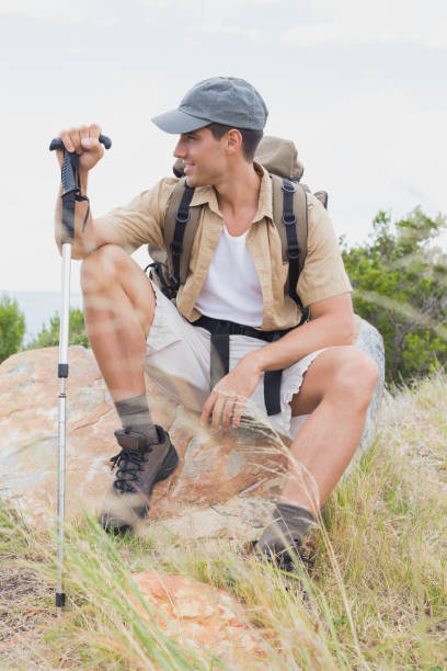 istock Hiking man sitting on mountain terrain 818828112