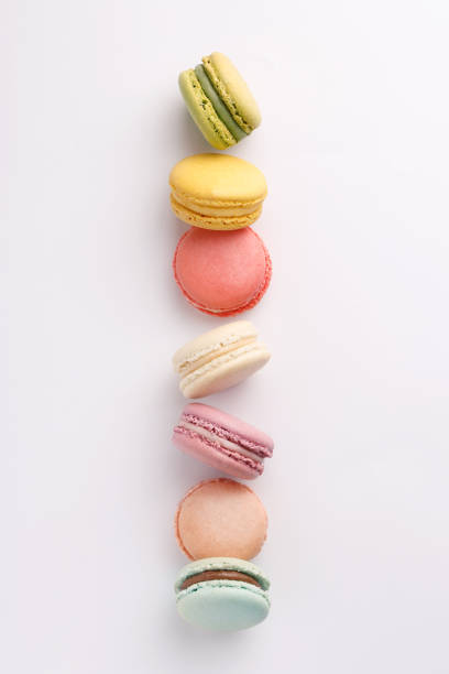 istock Macarons on white background. Colorful french desserts. Top view 818859400