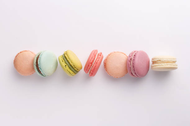 istock Macarons on white background. Colorful french desserts. Top view 818859402