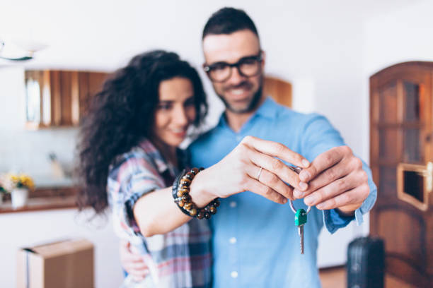 istock Young couple moving in new apartment 818873296