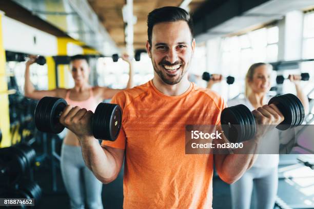 Group Of Friends Exercising Together In Gym Stock Photo - Download Image Now - Men, Gym, Smiling