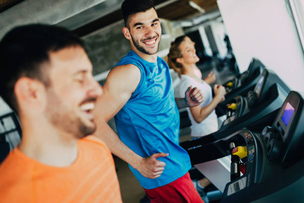 istock Group of friends exercising on treadmill machine 818874892