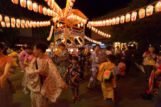 Sugamo Bon Odori Festival in Tokyo, Japan Tokyo, Japan - July 29, 2016 : Bon Odori Dancers at the Sugamo Bon Odori Festival in Toshima Ward, Tokyo, Japan. Bon dance, is a style of dancing performed during Obon. yukata photos stock pictures, royalty-free photos & images