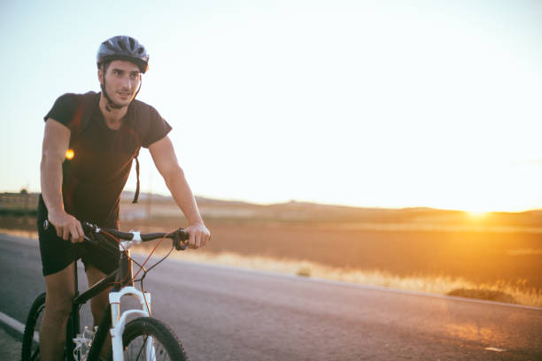 istock Cyclist riding a mountain bike 818876716