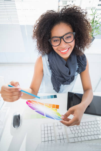 istock Pretty designer working at her desk 818881840