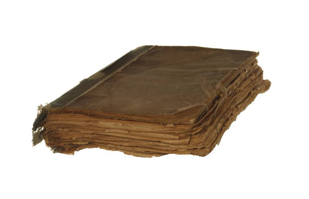 istock Very old and worn book isolated on white background. 818896994