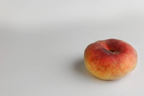 istock ripe peach fruits on white background 818924710