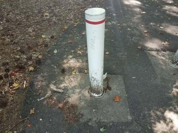istock white metal pole with red stripe on asphalt 818938806