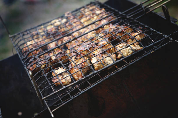 istock Meat being grilled in a barbecue 818952346