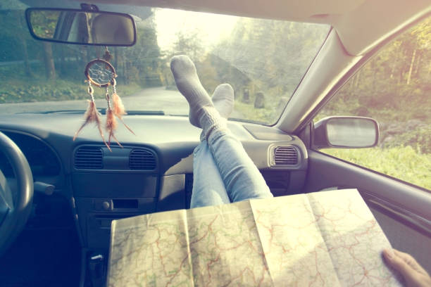 istock Two traveling friends check the right way on the map 818977102