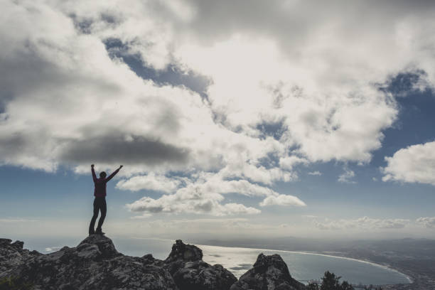 istock Woman stands arms outstretched 819026346