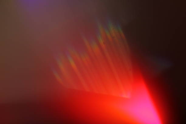 istock Abstract background - light color flashes and rays on black. Lens flare. For use as texture layer in your project. Add as 