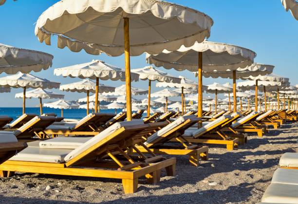 istock beach beds and umbrellas closeup 819069146