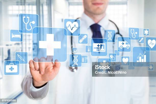 Medical Doctor Showing Icons Of Healthcare Services Hospital Background Stock Photo - Download Image Now