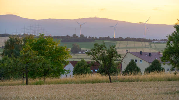 istock Beautiful sunset over a field and a small town in Germany. 819108622