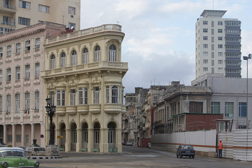 Havana, Cuba-January 28, 2017: Old buildings are remodeled at Havana. Incidential people in the front.