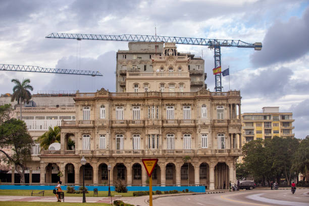 Havana, Cuba-January 28, 2017: Old buildings are remodeled at Havana. Incidential people in the front.