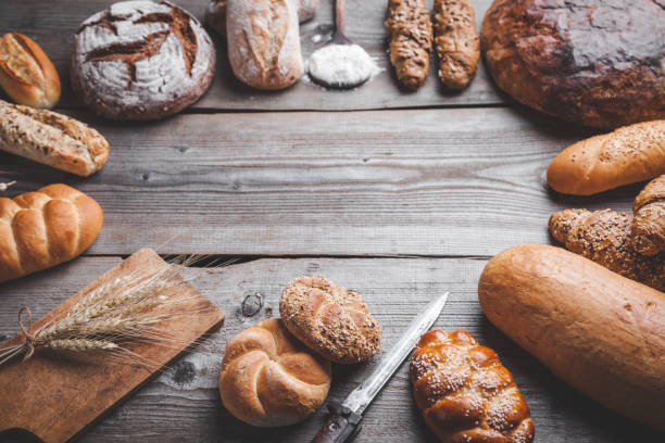 istock Delicious fresh bread on wooden background 819118028